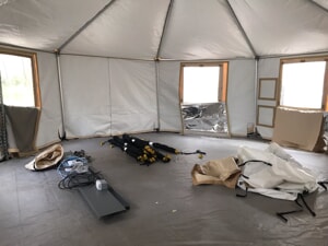 tent equipment being broken down